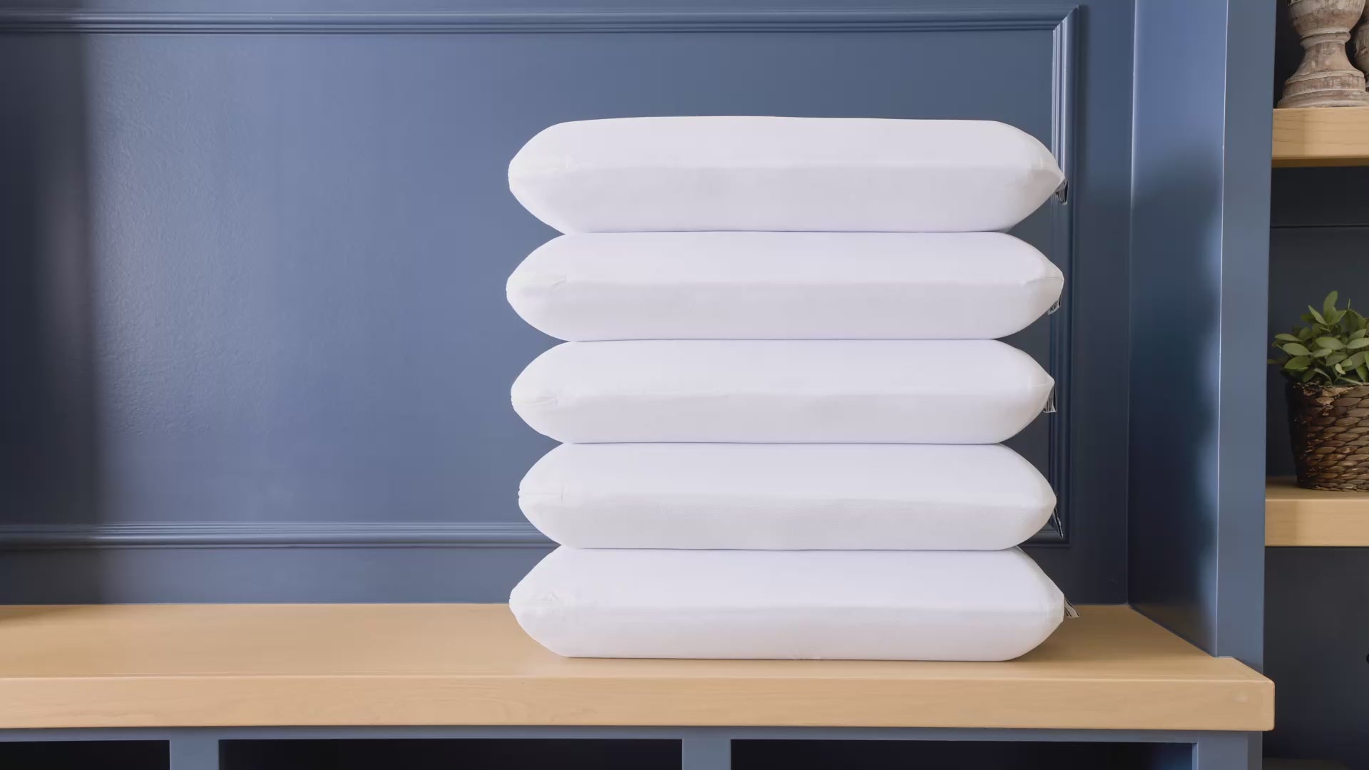 Video of a Ziwi mattress and woman climbing onto a bed and laying her head down on a ZiPP pillow, with text highlights of the ZiPP pillow's features and benefits